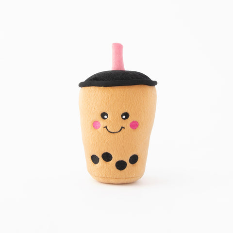 A picture of a boba milk tea plush toy with a white background.